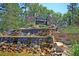 A tiered stone waterfall surrounded by lush landscaping greets you at the community's entrance at 9829 English Elm St, Ladson, SC 29456