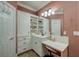 Bathroom featuring white vanity, storage cabinets, and a vanity table at 101 Firestone Ct, Summerville, SC 29483