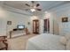 Bedroom with a large bed, tray ceiling, and display cabinet at 101 Firestone Ct, Summerville, SC 29483