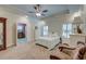 Bedroom with a tray ceiling, fan, carpet, and traditional furnishings at 101 Firestone Ct, Summerville, SC 29483