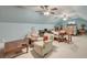 A spacious bonus room features a seating area, dining table, and sleeping area, offering versatility and comfort at 101 Firestone Ct, Summerville, SC 29483