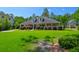 Beautiful single-story home featuring a covered porch, manicured lawn, and mature landscaping at 101 Firestone Ct, Summerville, SC 29483