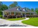Inviting home exterior showcasing a long front porch, manicured landscaping, and a charming walkway at 101 Firestone Ct, Summerville, SC 29483