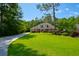 Beautiful single-story home featuring a well-manicured lawn and an extensive driveway at 101 Firestone Ct, Summerville, SC 29483