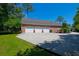 Spacious three-car garage with a brick exterior, offering ample parking and storage solutions at 101 Firestone Ct, Summerville, SC 29483