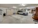 Spacious three car garage with an epoxy floor, providing plenty of room for vehicles and storage at 101 Firestone Ct, Summerville, SC 29483