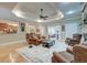 Spacious living room boasts hardwood floors, custom lighting, and comfortable seating, offering ideal gathering space at 101 Firestone Ct, Summerville, SC 29483