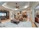Spacious living room features hardwood floors, custom lighting, comfortable seating, and an open floor plan at 101 Firestone Ct, Summerville, SC 29483