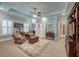 Large main bedroom with built-ins, ceiling fan, sitting area and natural light, offering a relaxing retreat at 101 Firestone Ct, Summerville, SC 29483