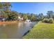 View of the large pond with a fountain in the center and green foliage around the edges at 101 Firestone Ct, Summerville, SC 29483