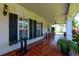 Relaxing outdoor porch with tile flooring, rocking chairs, and open views at 101 Firestone Ct, Summerville, SC 29483