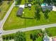 Spacious property featuring a well-maintained lawn, detached garage, and mature trees in a desirable neighborhood at 101 Parkside Dr, Goose Creek, SC 29445
