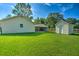Spacious backyard featuring a well-maintained lawn, outbuilding, and ample space at 101 Parkside Dr, Goose Creek, SC 29445