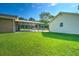 Large, well-maintained backyard with a covered carport and ample space for outdoor activities at 101 Parkside Dr, Goose Creek, SC 29445