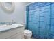 Bathroom featuring toilet, vanity and cabinet, with a blue mosaic pattern shower curtain at 101 Parkside Dr, Goose Creek, SC 29445
