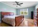 Relaxing bedroom featuring hardwood floors, a ceiling fan, and natural light from the window at 101 Parkside Dr, Goose Creek, SC 29445