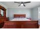 Comfortable bedroom featuring hardwood floors, neutral walls, window and ceiling fan at 101 Parkside Dr, Goose Creek, SC 29445