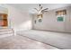 Large open bonus room, featuring tile floors, carpeted area, and a ceiling fan at 101 Parkside Dr, Goose Creek, SC 29445