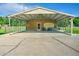 Large carport perfect for cars and activities, featuring an American flag at 101 Parkside Dr, Goose Creek, SC 29445
