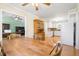 Inviting dining room boasts a wooden table and chairs, flowing into the kitchen and second living area at 101 Parkside Dr, Goose Creek, SC 29445