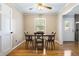 Dining room with hardwood floors, ceiling fan, and natural light from the window at 101 Parkside Dr, Goose Creek, SC 29445