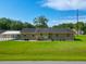 Charming single story brick home with a covered carport and well-manicured lawn, creating a warm curb appeal at 101 Parkside Dr, Goose Creek, SC 29445