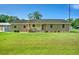 Charming single story brick home with a covered carport and well-manicured lawn, creating a warm curb appeal at 101 Parkside Dr, Goose Creek, SC 29445