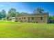 Charming single story brick home with a covered carport and well-manicured lawn, creating a warm curb appeal at 101 Parkside Dr, Goose Creek, SC 29445