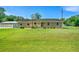 Brick home with covered parking and a large front yard, creating a welcoming curb appeal at 101 Parkside Dr, Goose Creek, SC 29445