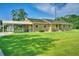 Charming single story brick home with covered parking and a well-manicured lawn in a suburban neighborhood at 101 Parkside Dr, Goose Creek, SC 29445