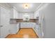 Bright kitchen featuring white cabinets, granite countertops, and modern appliances at 101 Parkside Dr, Goose Creek, SC 29445
