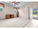 Spacious living room featuring neutral carpeting, ceiling fan, and natural light at 101 Parkside Dr, Goose Creek, SC 29445