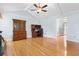 Open living room with hardwood floors, vaulted ceilings, and a flexible layout at 101 Parkside Dr, Goose Creek, SC 29445