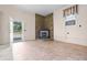 Living room with stone fireplace, tile flooring, and access to a front porch at 101 Parkside Dr, Goose Creek, SC 29445