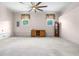 Bright living room with white walls, ceiling fan, and natural lighting at 101 Parkside Dr, Goose Creek, SC 29445