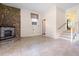 Living room featuring a stone fireplace and tile flooring at 101 Parkside Dr, Goose Creek, SC 29445