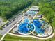 Aerial view of a modern playground with blue sunshades and manicured landscape at 101 Parkside Dr, Goose Creek, SC 29445