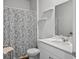 Clean bathroom with a shower curtain, white vanity, and modern fixtures at 1014 Peridote Way, Ladson, SC 29456