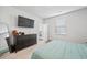 Clean bedroom with flat screen, dresser, and doorway leading to the hallway at 1014 Peridote Way, Ladson, SC 29456