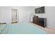 Well-lit bedroom with a comfy blue bedspread, dresser, and a view into the en suite bathroom at 1014 Peridote Way, Ladson, SC 29456