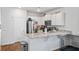 Kitchen featuring white cabinets, granite countertops, stainless steel appliances and wood floors at 1014 Peridote Way, Ladson, SC 29456