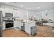 Bright, open-concept kitchen with granite countertops, stainless steel appliances and open to the living room at 1014 Peridote Way, Ladson, SC 29456