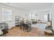Bright living room features modern decor, wood floors, and comfortable seating arrangements at 1014 Peridote Way, Ladson, SC 29456