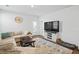Comfortable living area features a flat screen TV, decorative carpet, and a neutral color scheme at 1014 Peridote Way, Ladson, SC 29456