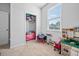 Well-organized playroom with toys, play kitchen, and a view outside the window at 1014 Peridote Way, Ladson, SC 29456