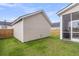 Backyard view with a shed, a screened-in porch, and a wooden fence at 1017 Marsh Royal St, Summerville, SC 29485