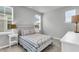 Cozy bedroom with a metal bed frame, carpet flooring and windows that provide natural light at 1017 Marsh Royal St, Summerville, SC 29485