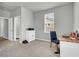 Bedroom with carpet, desk, chair, and window for natural light, attached bathroom nearby at 1017 Marsh Royal St, Summerville, SC 29485