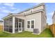 Exterior of the home with a screened-in porch and a small air conditioning unit at 1017 Marsh Royal St, Summerville, SC 29485