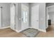 Bright foyer showcasing a modern front door with glass, a stylish rug, and beautiful hardwood floors at 1017 Marsh Royal St, Summerville, SC 29485
